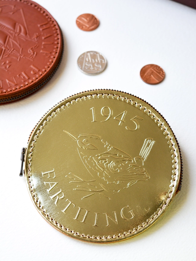 a gold leather farthing coin purse from 1945 with a wren bird embossing
