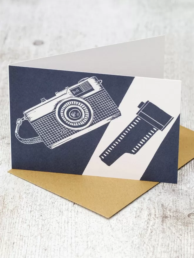 Greeting Card with an image of an Olympus Trip And A Roll Of Film, taken from an original lino print