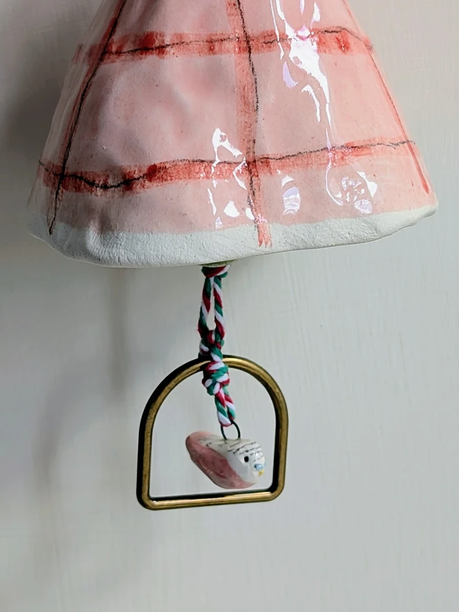 budgie bell with pink bird hanging from the bottom, pink gingham bell 