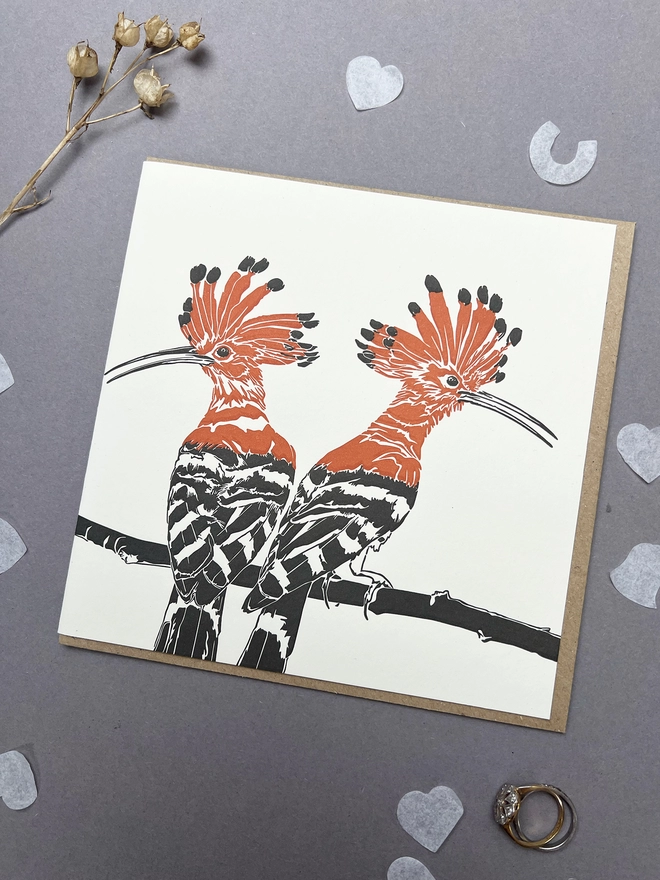 Image of two Hoopoes perching on a branch in love bold letterpress print colours of red and black