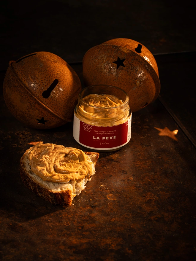 Yellow nutty spread in a red jar