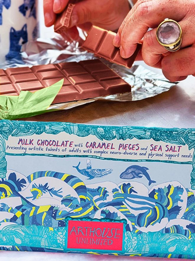 Charity milk chocolate with caramel & sea salt wrapped in foiled card with blue whales design 