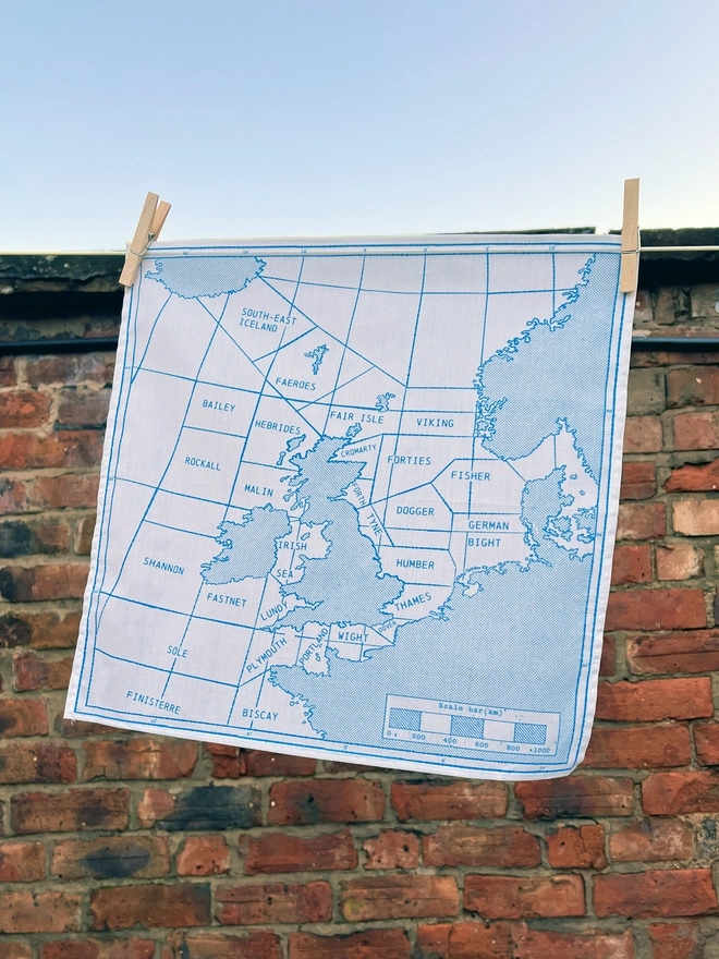 A Mr.PS Shipping Handkerchief pegged on a washing line