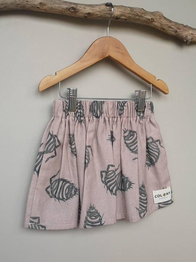 Girls Cotton Linen Pink Woodlouse Print Skirt. Elasticated Waist and Side Seam Pockets.