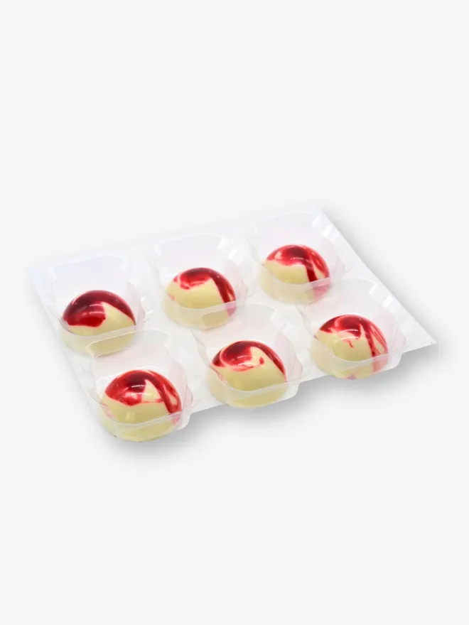 A tray of 6 luxury strawberry and cream white chocolates