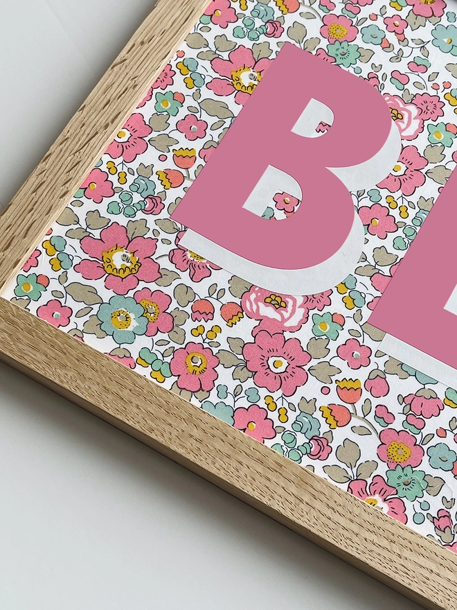 Personalised framed word/name picture in pink with white highlights on Liberty Betsy pink fabric - close up