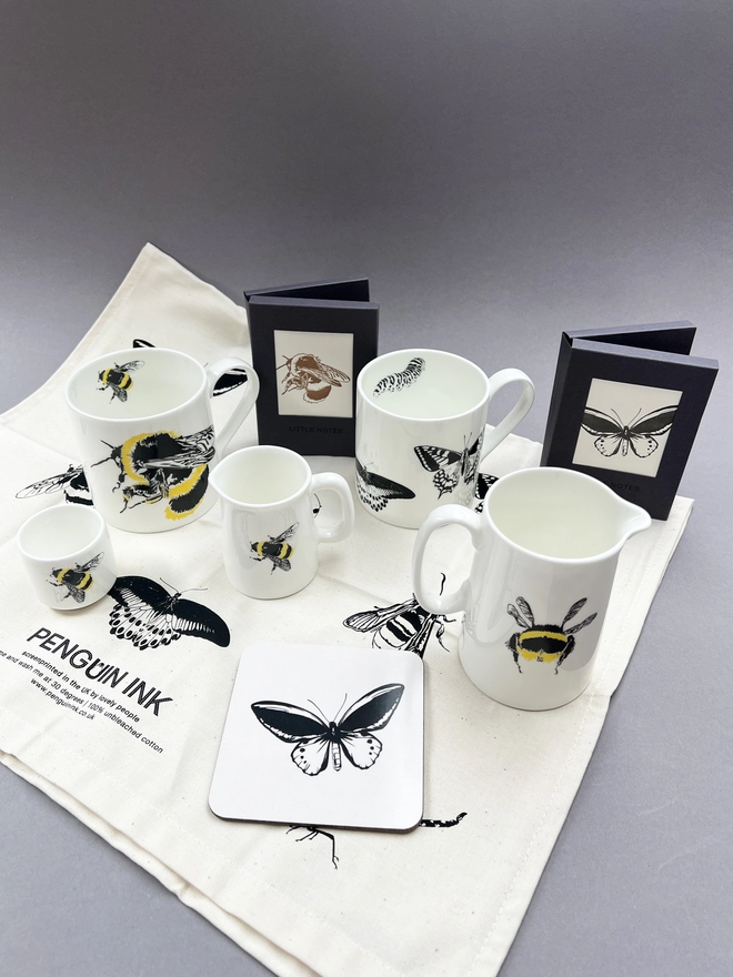 Product group image with insect tea towel, bee mug, eggcup and jugs, butterfly coaster and mug 