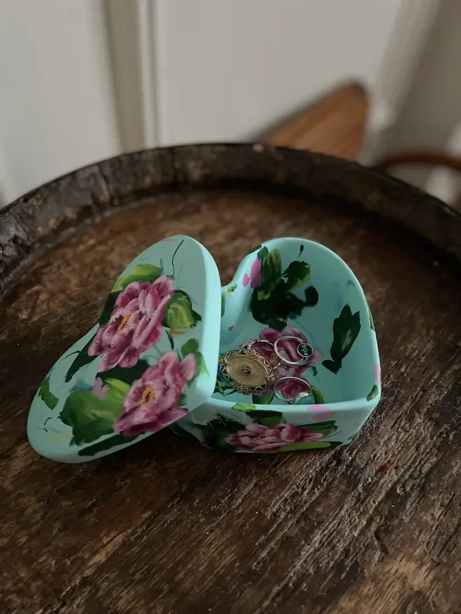hand painted floral ceramic heart shaped keepsake box background in a pale blue with pink peony flowers