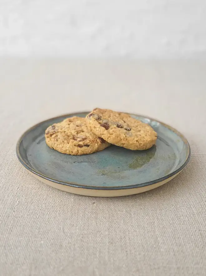 teal ceramic cake plate with textured swirl design