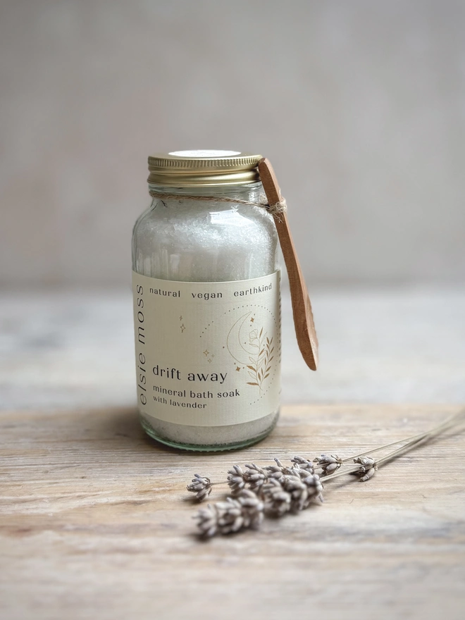 jar of Drift away bath soak with wooden spoon