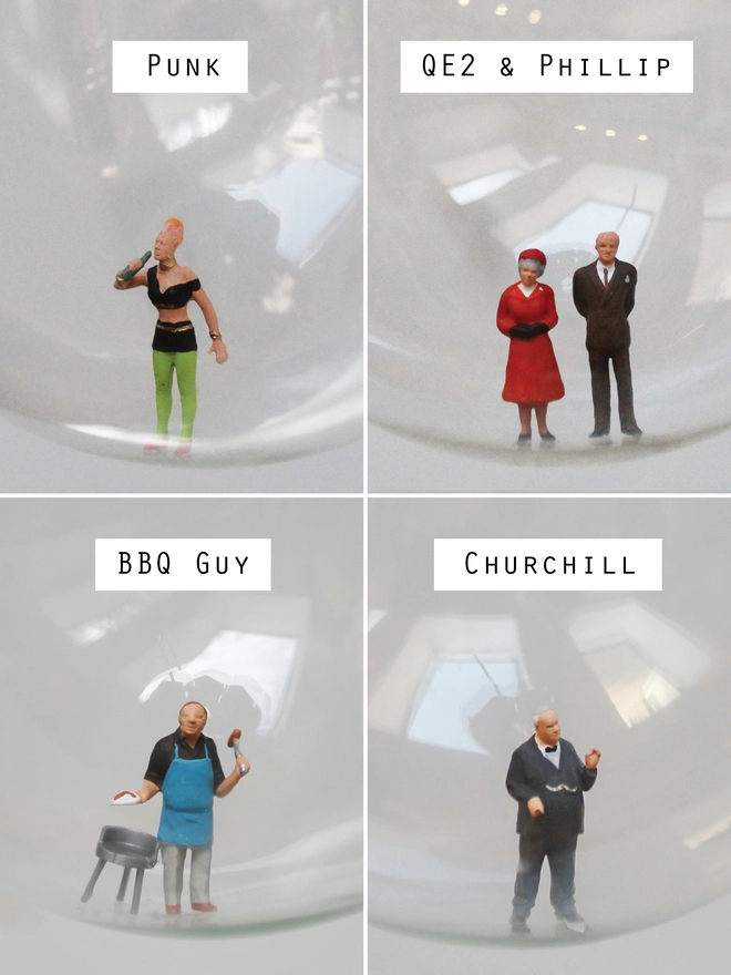 Miniature figures of a punk, queen elizabeth 2 and Prince Phillip, man at bbq, Winston Churchill in Christmas baubles