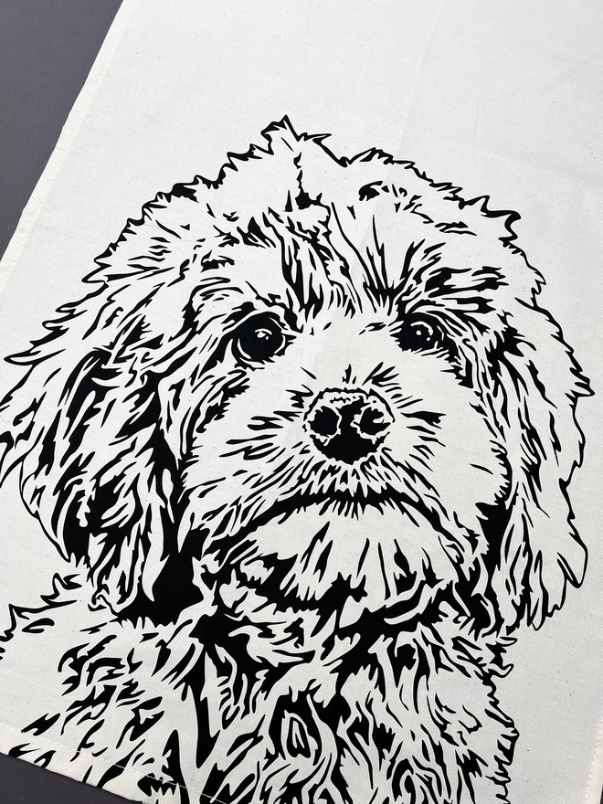 Close up of the cockapoo printed on the tea towel