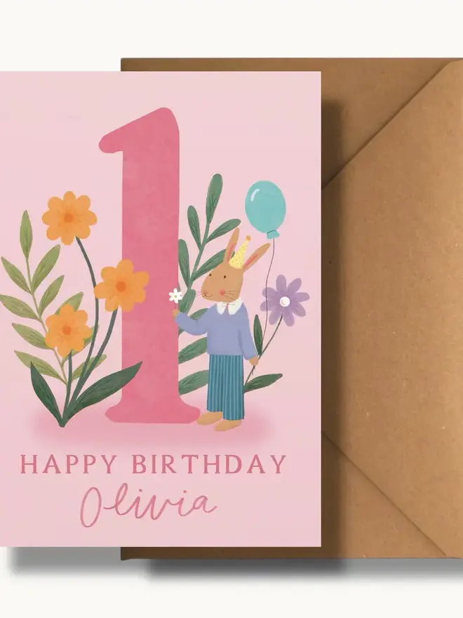 personalised floral 1st birthday card. pink 1st birthday card with illustrated rabbit and flowers.