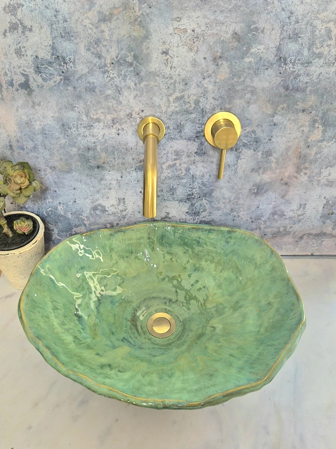 Green Ceramic Bathroom Basin, ensuite, WC, Sink, Crafted from stoneware clay, bathroom edit, bathroom furniture, bathroom decor, gold taps, floral wallpaper, homeware, Jenny Hopps Pottery, J.Hopps Pottery, J.H Pottery