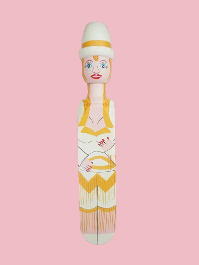 Wooden Door Stopper (Doll Gold Outfit), a colourful wooden door stop sitting on a white surface. 