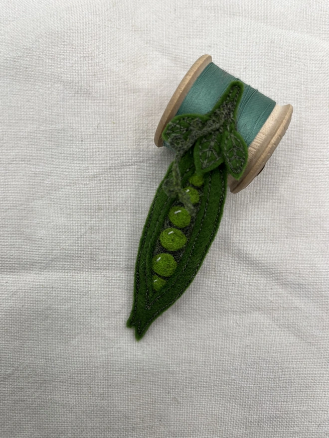 Pea pod and cotton reel