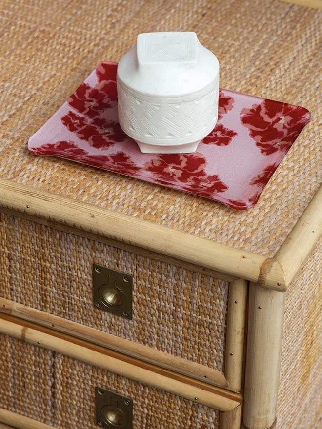 Acrylic Midi Tray, a colourful and patterned tray on a hamper. 