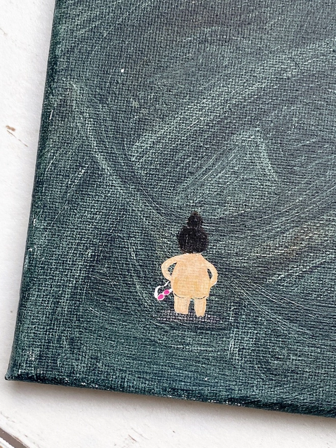 small canvas painting with dark blue background and nude swimmer with pink goggles