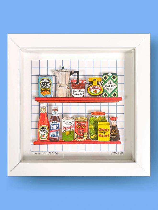 3D paper collage showing favourite cupboard staples on a shelve framed