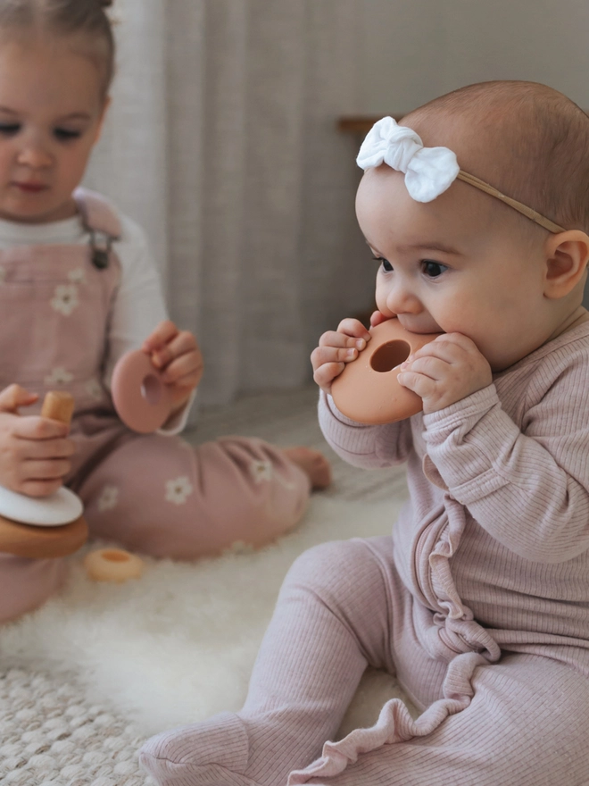 Baby with stacking teething toy