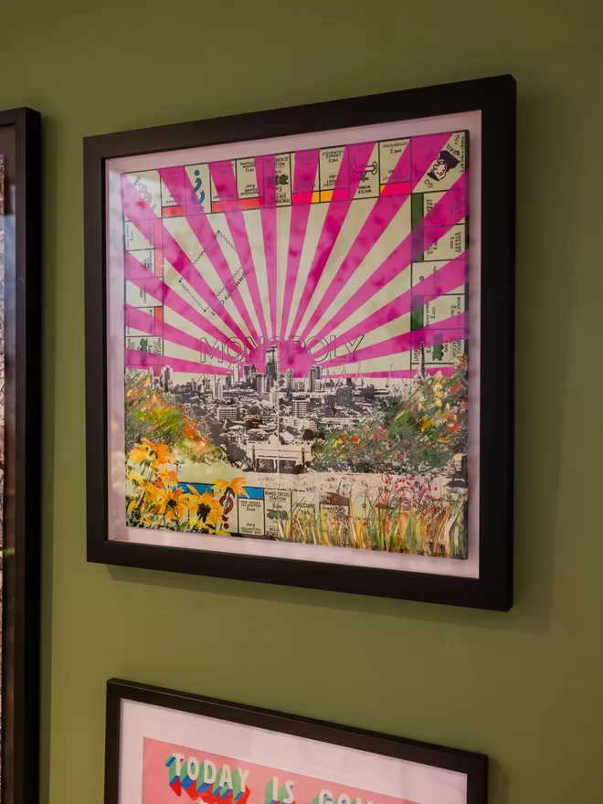 Monopoly Board with view of London printed on top and pink stripes
