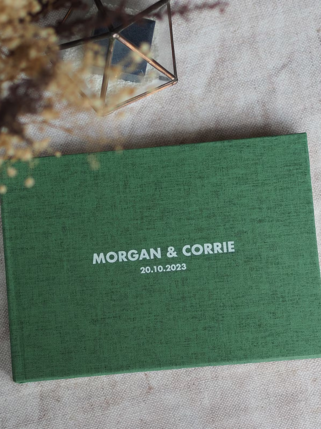 personalised wedding guestbook. a personalised wedding guestbook in green.