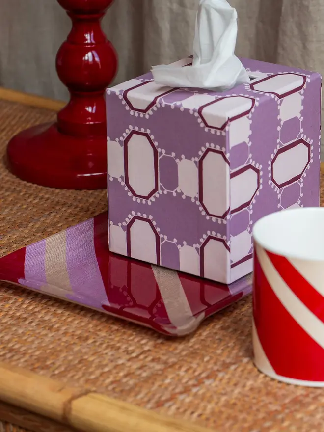 Acrylic Midi Tray, a colourful and patterned tray on a hamper. 