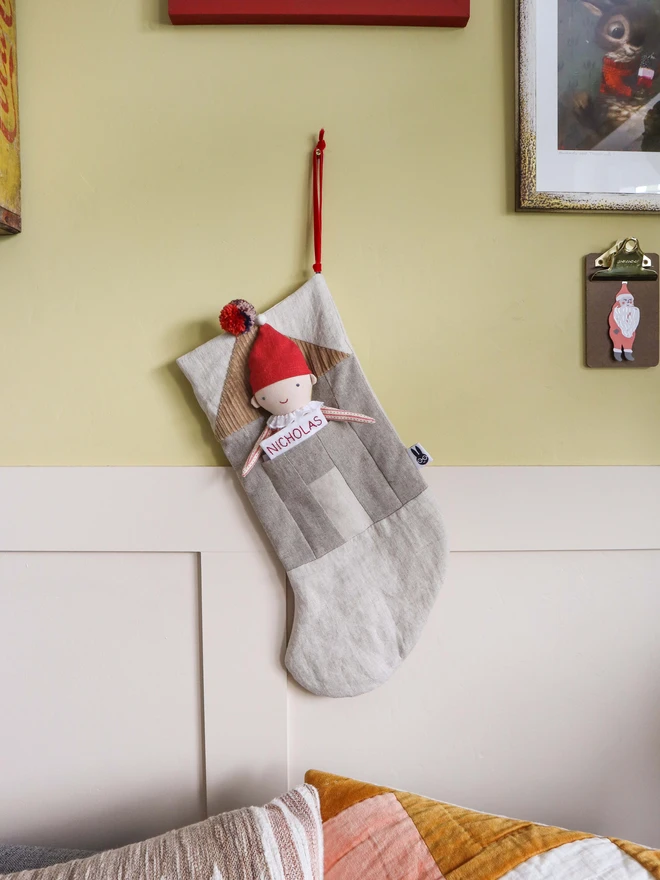 Personalised Linen Christmas Stocking with Christmas presents and elf dolls