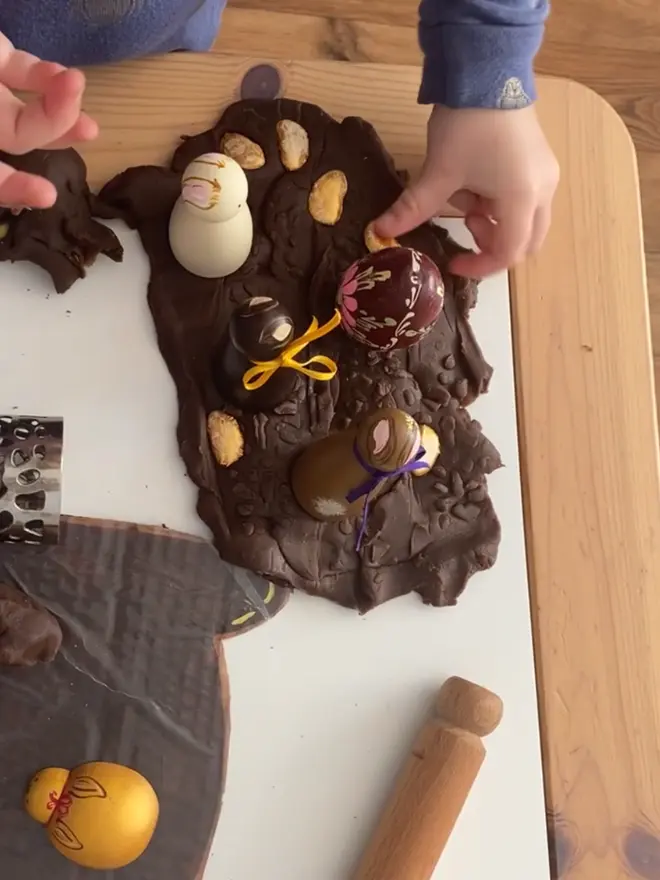 child playing with chocolate play dough