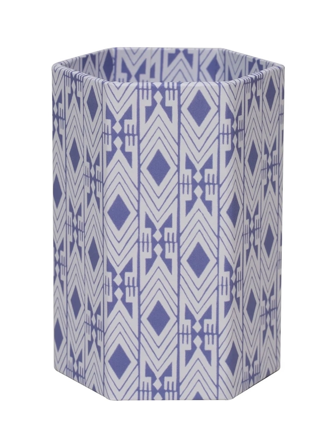 Tijan Hexagonal Brush Pot, a colourful patterned pencil pot sitting on a white surface against a plain backdrop.