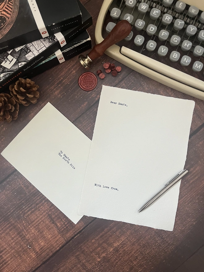 letter to santa, hand typed onto handmade cotton rag paper using an antique typewriter with a merry christmas red wax seal and envelope. 