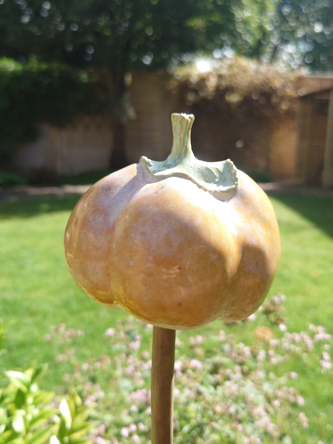 Stoneware pumpkin garden cane topper