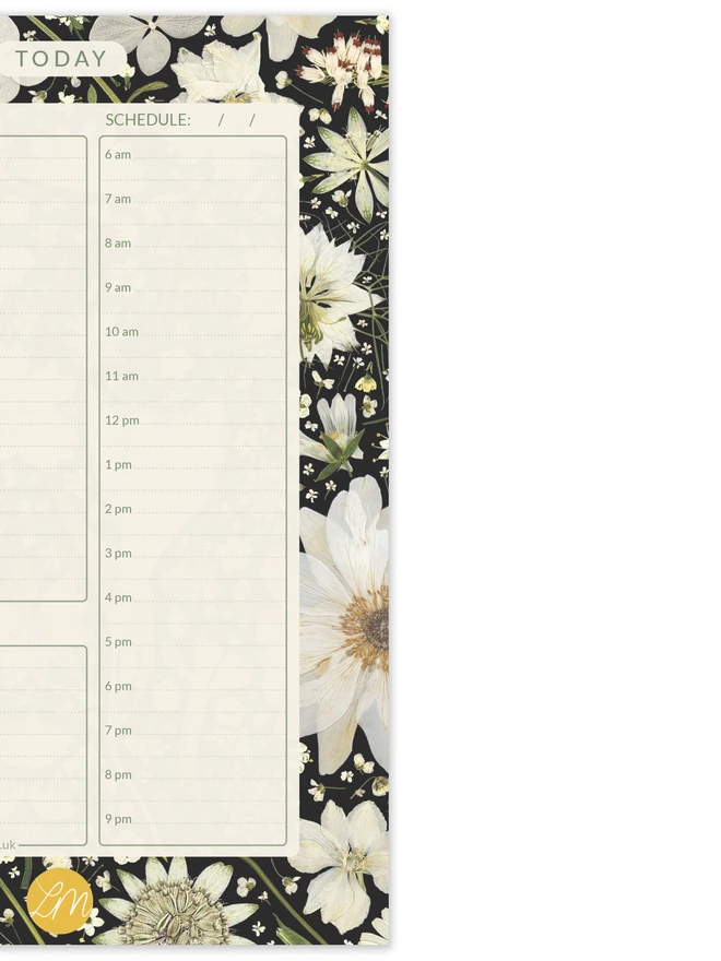 Close detail of Daily planner desk pad with elegant pressed white flowers on black background, perfect for task organisation at work or home; suitable for office professionals, parents, and creative planners.