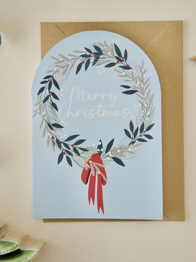 Botanical Wreath merry Christmas card with blue background