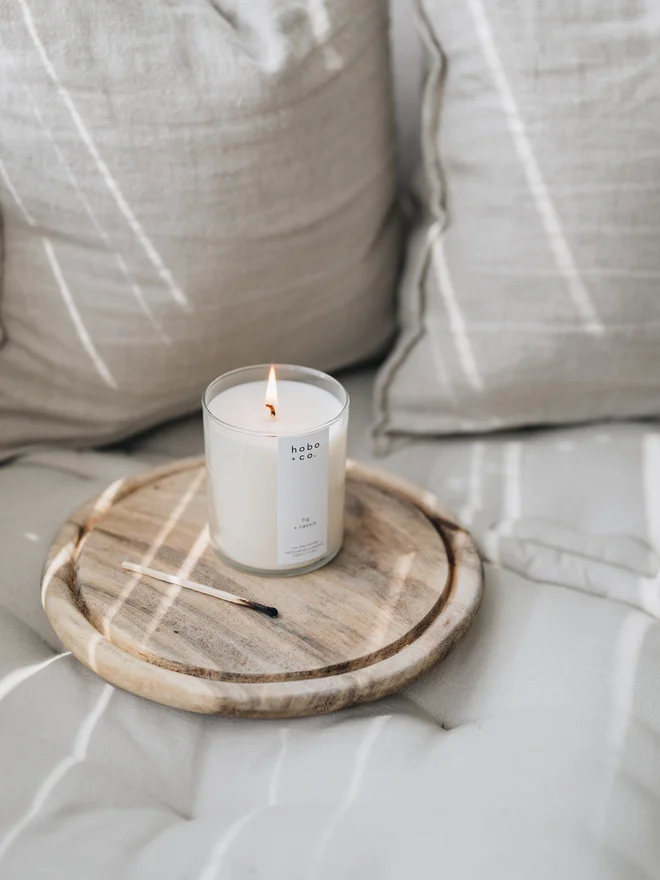 fig and cassis large candle lit in a living room setting