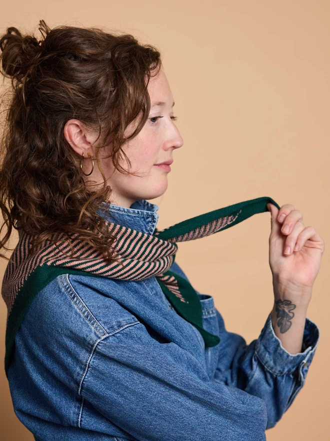 woman wearing green and pink stripe wool neckerchief