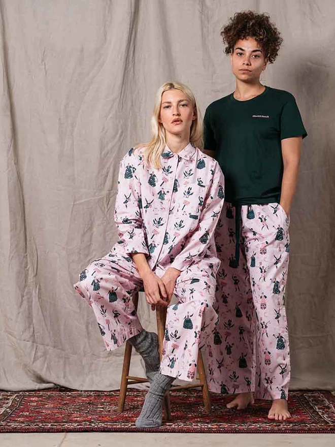 Two models showing our feminist icon pyjamas and our Black & Beech forest green icon t-shirt 