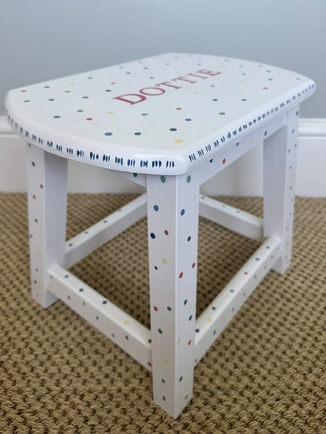 White wooden step stool personalised with the name Dottie in pink. 