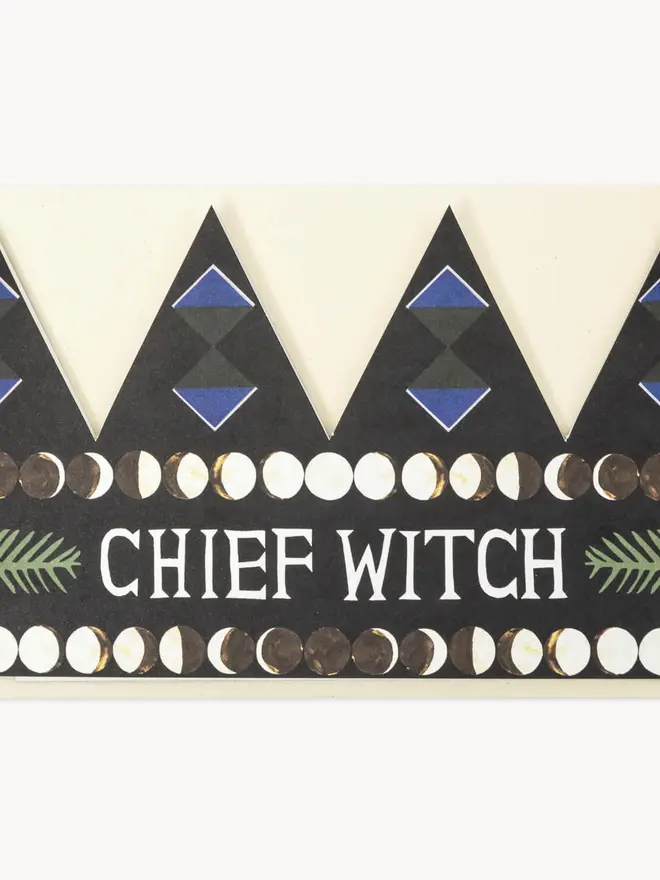 black crown shaped card with 'chief witch' text