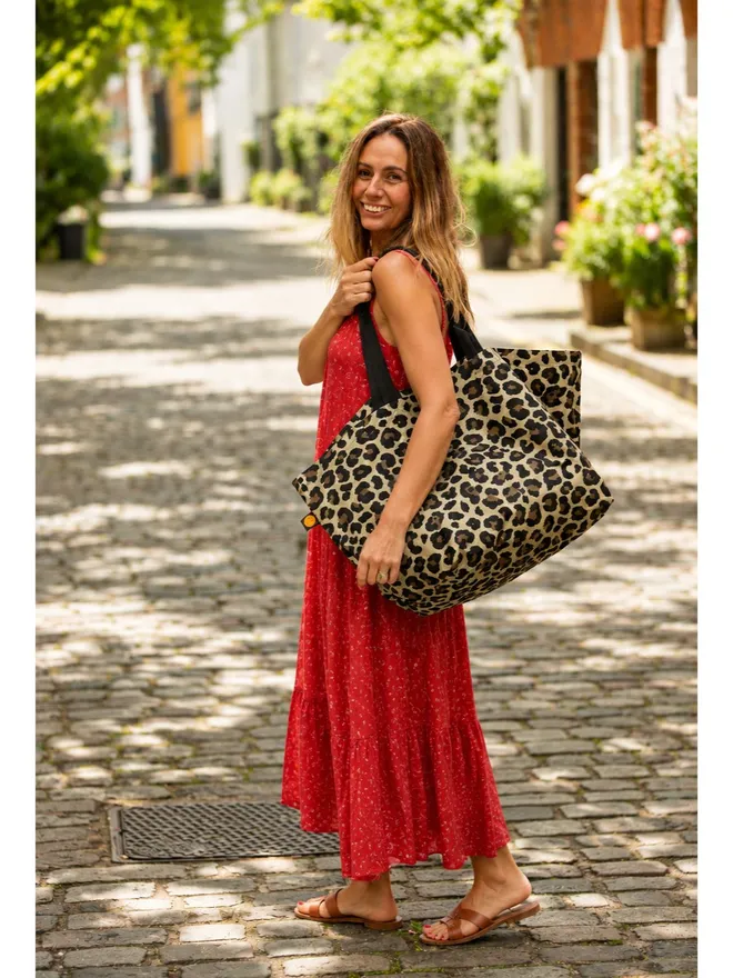 oversize leopard tote on woman wearing red summer dress
