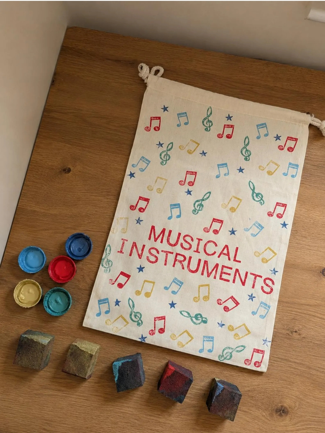 personalised musical bag. a drawstring bag with printed music symbols and a personalised name.