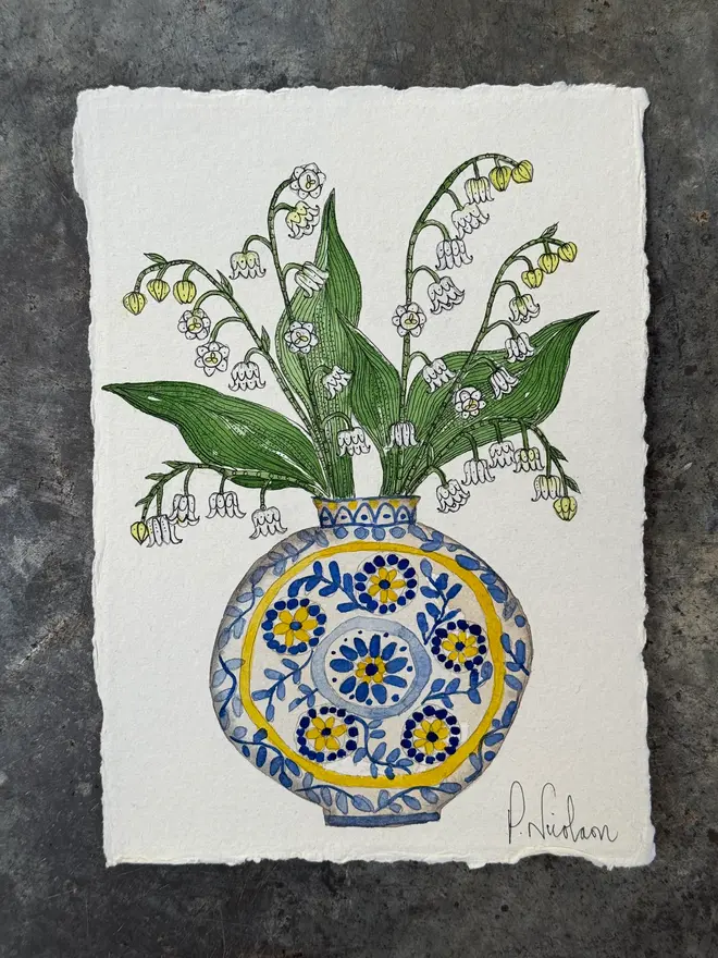Lily of the Valley flowers in a Blue & Yellow vase