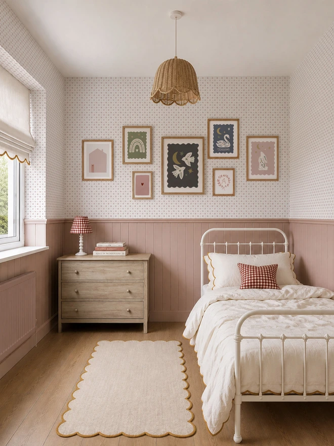 Ducks In A Row Stars & Spots Blush Wallpaper in girls bedroom with dusty pink wall panelling, scalloped trim linen bedding and gallery wall 