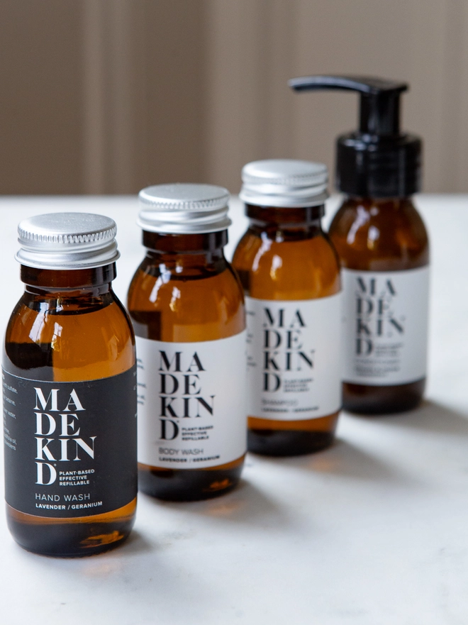 MadeKind natural toiletries in travel size amber glass bottles