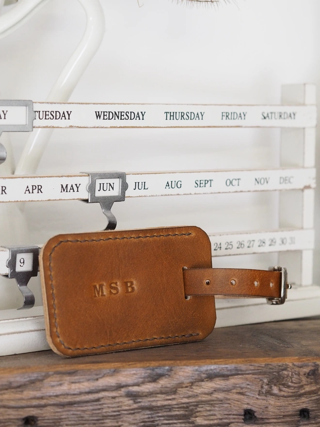 Personalised leather luggage tag. A handmade leather luggage tag, stamped with initials.