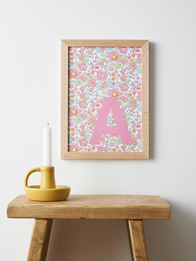 Personalised framed pink initial on Liberty Betsy pink fabric