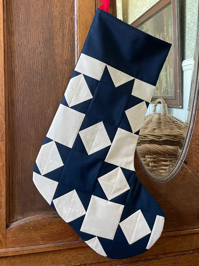 Astrid Patchwork Stocking Kit, hanging. 