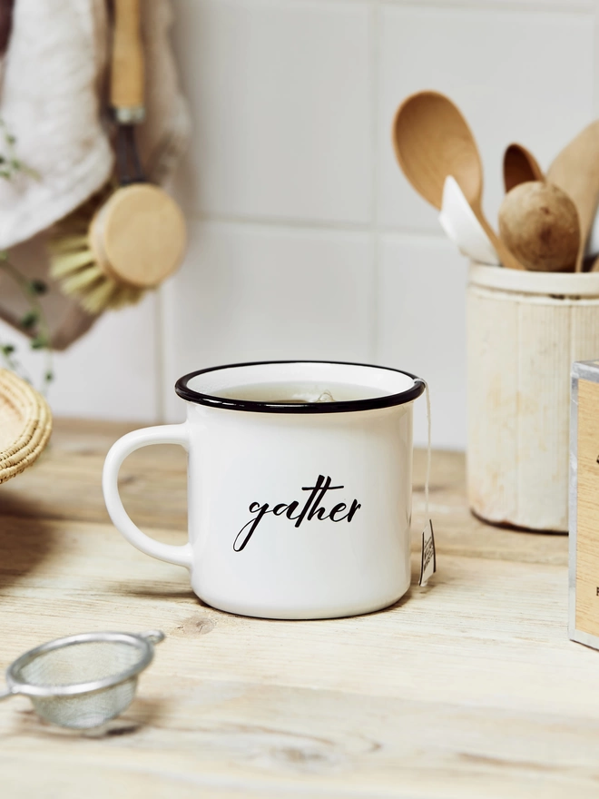 Ceramic mug printed with the word 'gather'