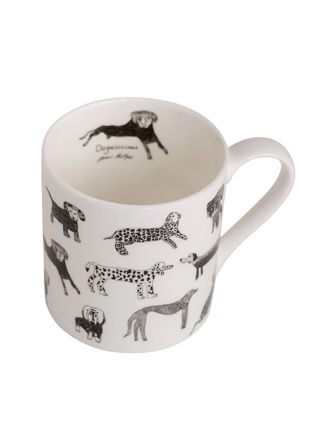 close up photo of dogalicious charity fine bone china dog gift mug featuring black dog illustrations