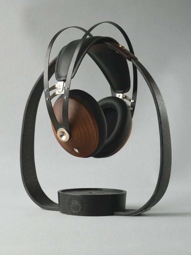 The Band Wooden Headphone Stand. An Ebonised (Black) headphone stand with Brown leather.